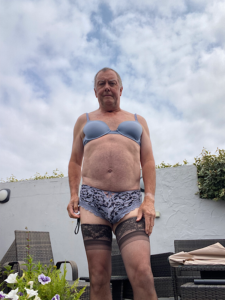 Faggot sissy Bryony in the garden in her undies