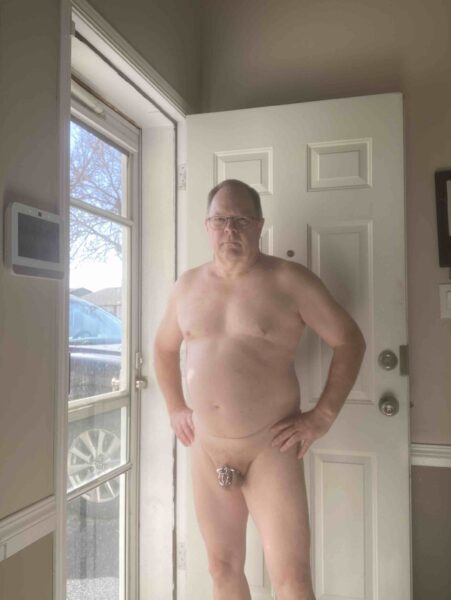 caged faggot in doorway